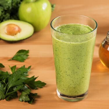 A glass of tropical green smoothie.
